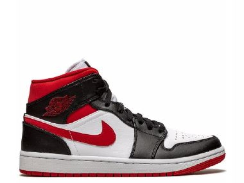 Nike Air Jordan 1 Mid amarillas con blanco y logo negro.