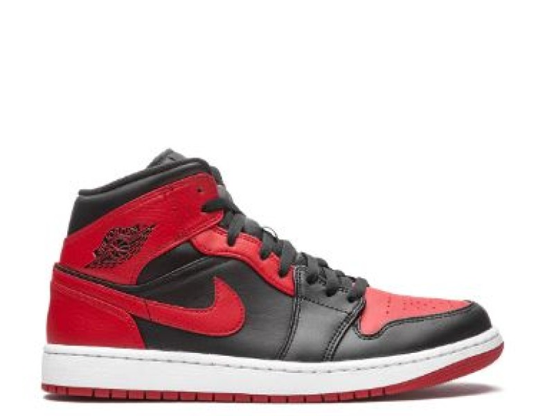 Nike Air Jordan 1 Mid amarillas con blanco y logo negro.